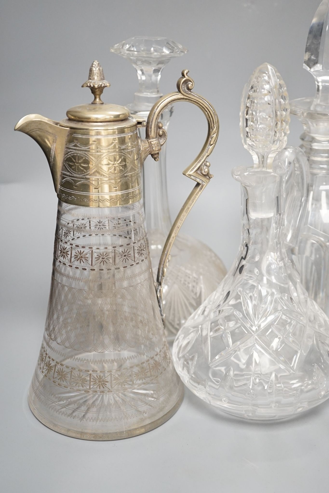 A Hukin and Heath claret jug and other decanters etc.
